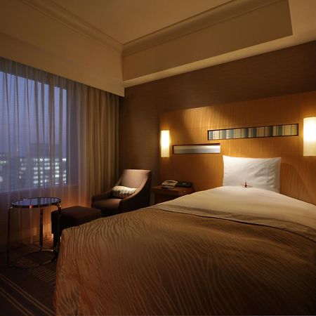 פוקואוקה Hotel Okura Fukuoka מראה חיצוני תמונה A room at the hotel