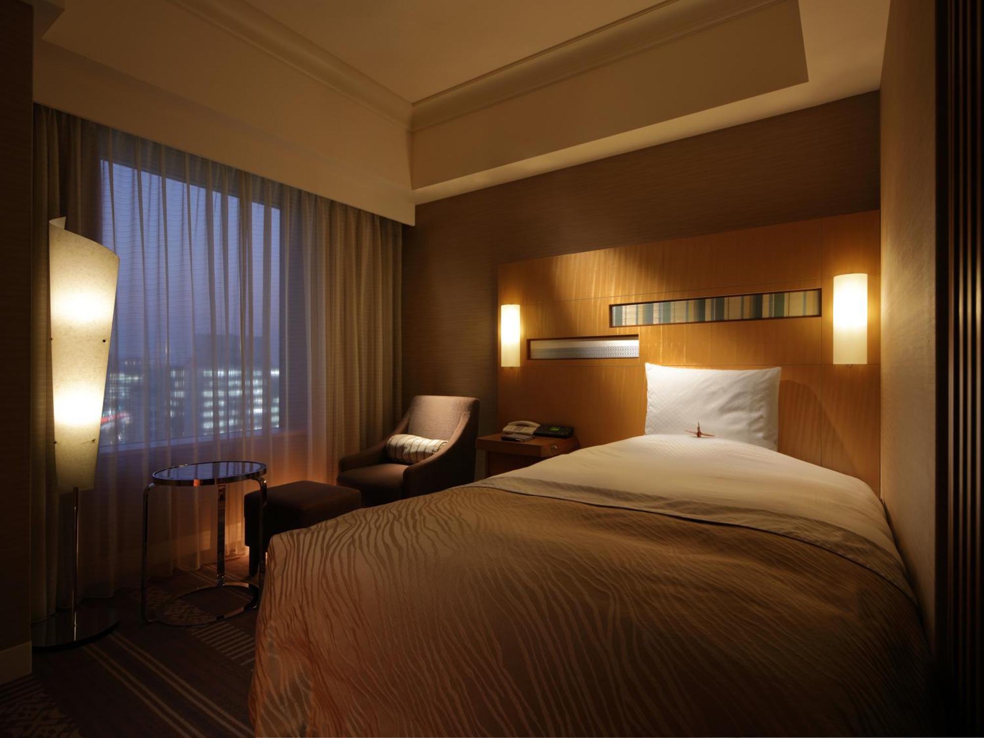 פוקואוקה Hotel Okura Fukuoka מראה חיצוני תמונה A room at the hotel